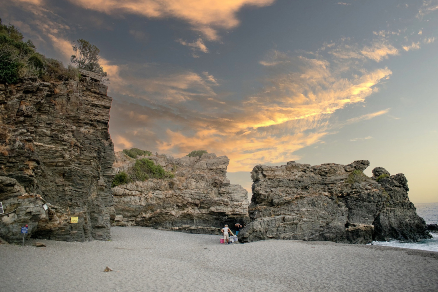 "The wild natural landscape of Korakas beach in South Crete, where the iconic large rock formations meet crystal blue waters and fine pebbles."
